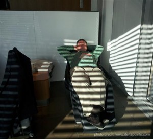a man lying on a chair