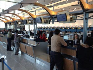 people standing at the counter of a terminal