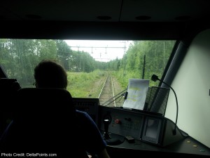 a person in a train cabin looking out the window