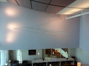 a white wall with a wire sculpture