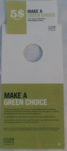 a white and green tag with a circle cut out