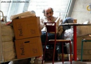 a man sitting in a room with boxes