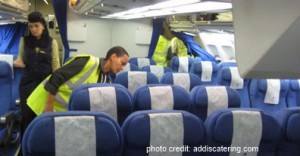 a woman in a safety vest in a plane