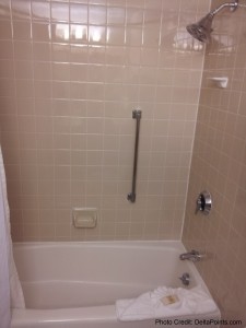 a bathroom with a bathtub and shower