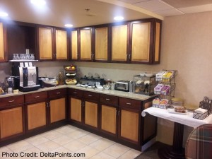 a kitchen with brown cabinets
