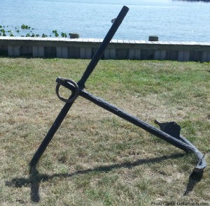a large anchor on grass