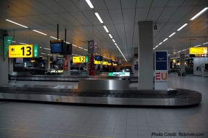 a luggage conveyor belt in an airport