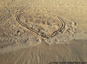 a heart drawn in sand