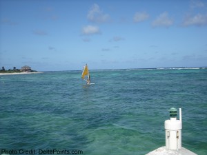 a person on a sailboat in the ocean