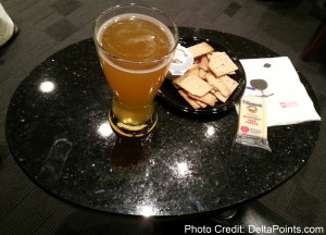 a glass of beer and crackers on a table