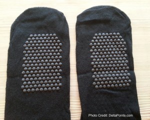a pair of black socks with black dots on them