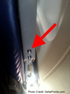 an arrow pointing to an airplane seat