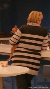 lady with dog at delta E skyclub atlanta delta points blog