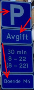 a blue street sign with white text